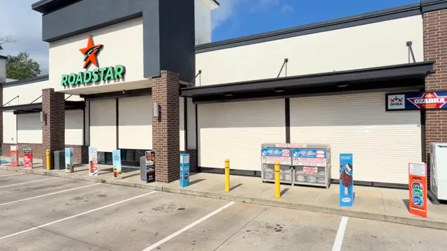Paired storefront bays. Rolling shutter installation